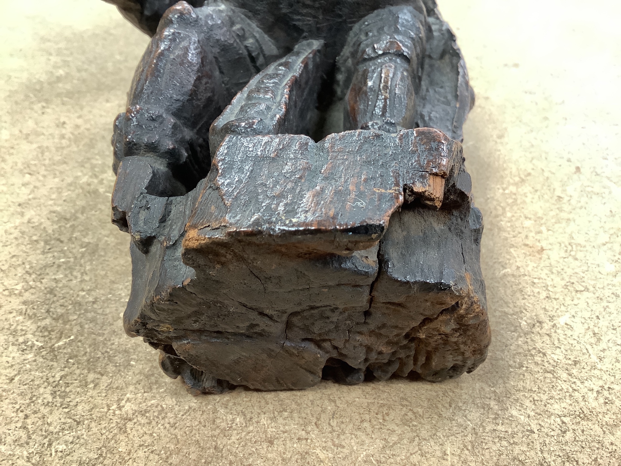 An Indian hardwood figural relief, 18th century or earlier, 28cm, a dagger and two carving knife sets